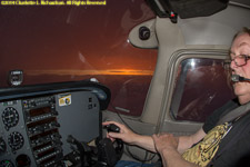 rain and sunset between cloud layers